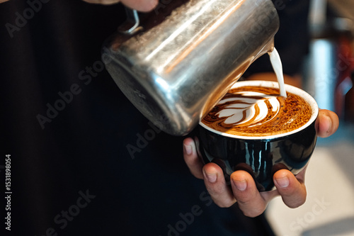 Fotografie Coffee Art In Black Mug