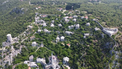 Aerial drone view of the Historic urban site of Počitelj, a traditional old village from Bosnia and Herzegovina.
