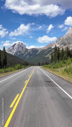 Driving Through Majestic Mountains on a Scenic Highway in British Columbia, Canada on a Sunny Day