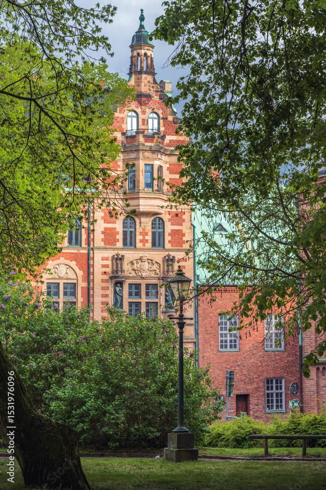 Obraz premium Historic buildings and park in Lund Sweden in summertime