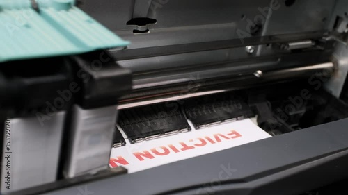 Close-up View of Inkjet Printer Print Heads Operating in Modern Office Environment with Paper