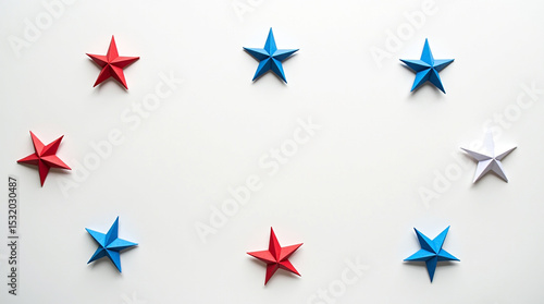 A patriotic array of red, white, and blue origami stars arranged in a circle, isolated on white background
