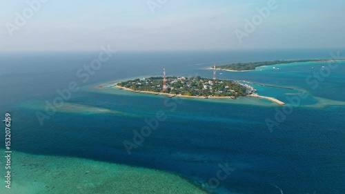 Wallpaper Mural A breathtaking aerial drone view captures Rasdhoo Island bathed in the warm glow of sunset in the Maldives. Torontodigital.ca