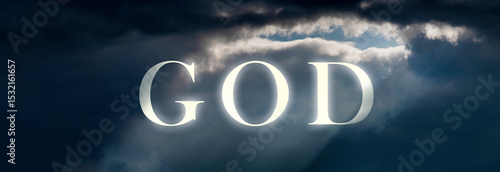God in the clouds. A bright, religious sign in the sky with sunlight piercing through. A concept of faith and heaven.
