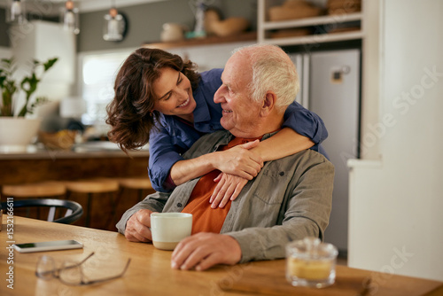 Wallpaper Mural Lovely adult daughter embracing senior father from beahid Torontodigital.ca