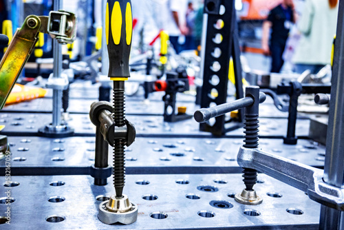 Photography The metal welding table with mounting bolts and professional tooling equipment f