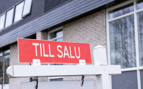 Sign saying for sale in Swedish language. House market sale sign.