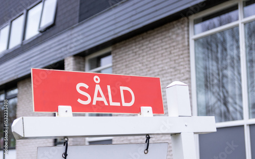 Sign saying sold In Swedish. House market sale sign.