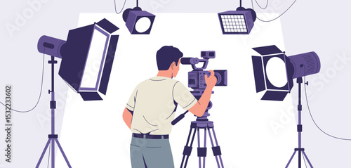 Filmmaker Shooting Video on Professional Camera with Studio Lighting