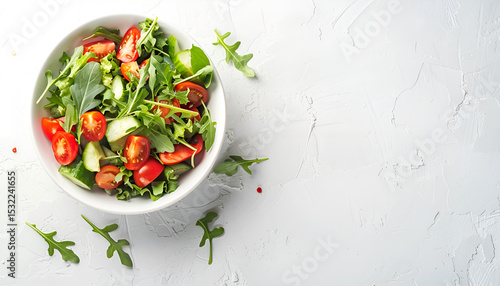 Bowl with delicious vegetable salad on white background, top view