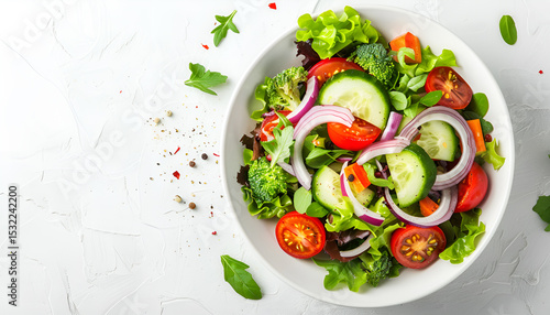 Bowl with delicious vegetable salad on white background, top view