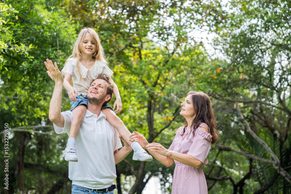 Fototapeta premium Happy family parent children having picnic outdoor activity. Enjoy happiness moment summer playing together including father mother son and daughter relaxing in the morning sunrise.