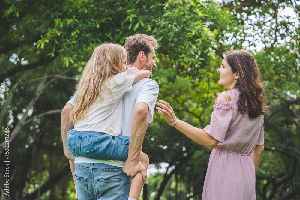 Fototapeta premium Happy family parent children having picnic outdoor activity. Enjoy happiness moment summer playing together including father mother son and daughter relaxing in the morning sunrise.