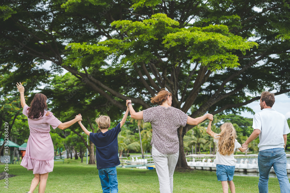 Obraz premium Happy family parent children having picnic outdoor activity. Enjoy happiness moment summer playing together including father mother son and daughter relaxing in the morning sunrise.
