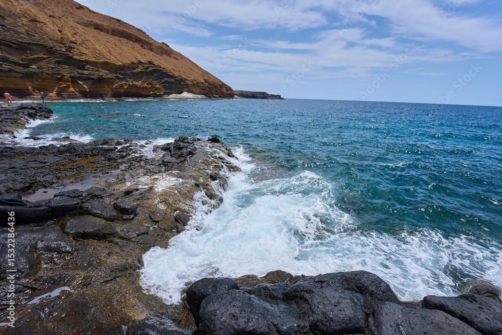 Volcanic shore at Playa Amarilla Volcanic shore at Playa Amarilla