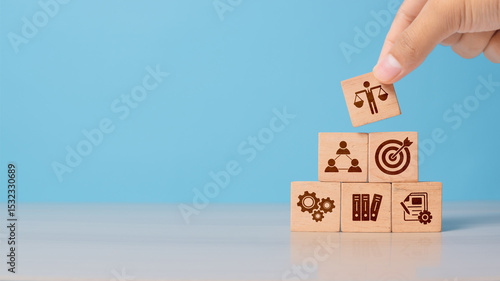 Foto Hand shows wooden block with business ethics icon