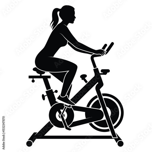 Woman silhouette on stationary exercise bike