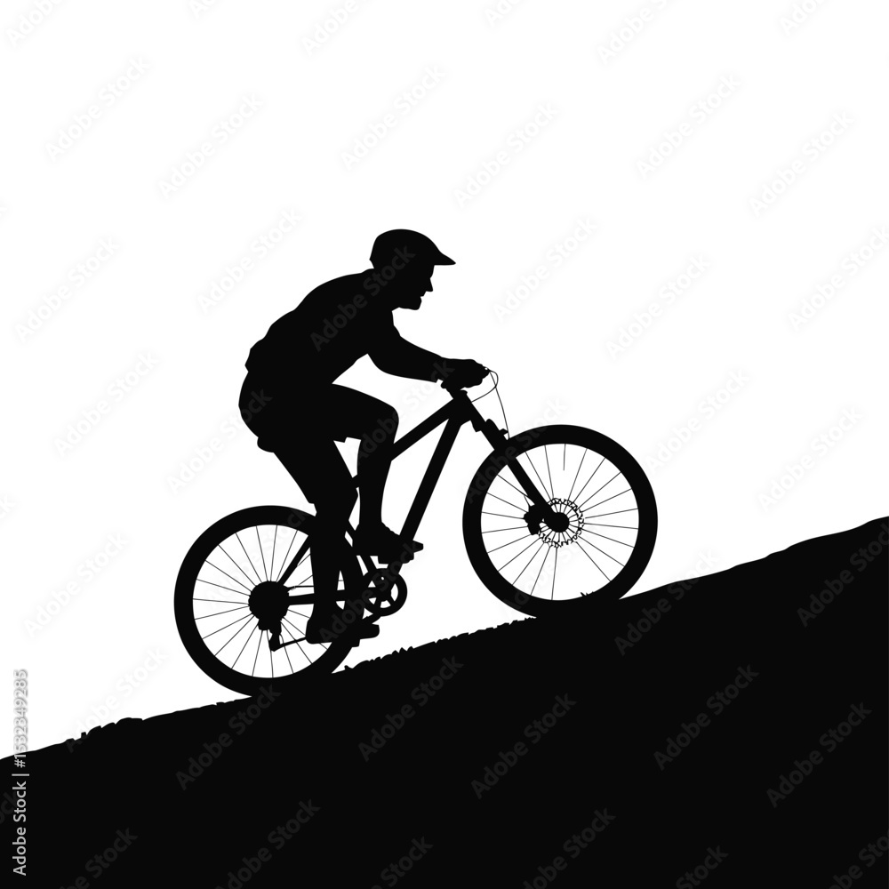 Fototapeta premium Mountain biker silhouette climbing hill
