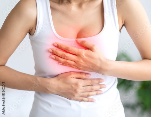 Wallpaper Mural Woman experiencing chest pain (1) Torontodigital.ca