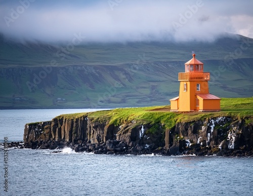 orange lighthouse at seashore of grimsey island nearby iceland