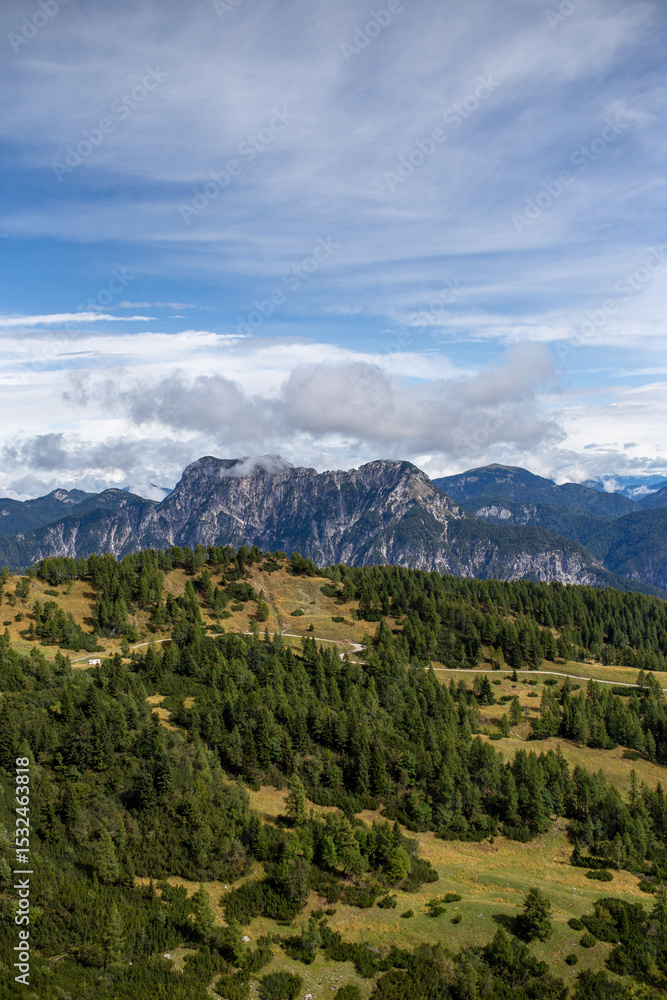 Alpine scenery on a serene day, showcasing the grandeur of nature and the human trace of a path. Alpine scenery on a serene day, showcasing the grandeur of nature and the human trace of a path.