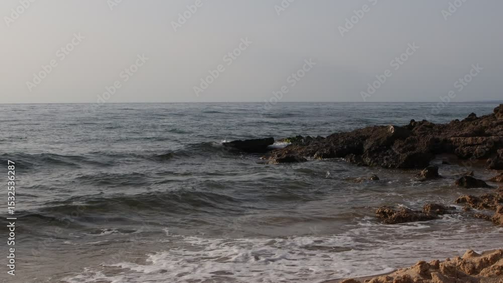 Rocky Shoreline with Gentle Sea Waves Rocky Shoreline with Gentle Sea Waves
