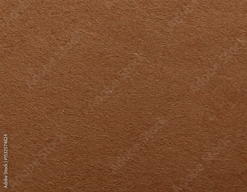 Close-up of brown felt fabric with fine texture and subtle irregularitie