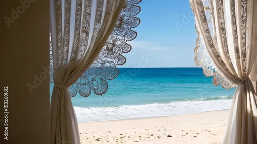 Tranquil ocean view from a window framed by lace curtains with azure water and a sandy beach.