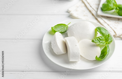 Wallpaper Mural Pieces of delicious mozzarella cheese and basil on white wooden table. Space for text Torontodigital.ca