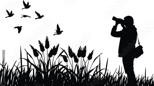 Silhouette Photographer, A  photographer capturing the picture of birds.