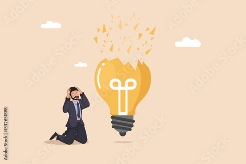 Broken Idea and Frustration: Businessman Kneeling Beside a Shattered Light Bulb, Symbolizing Failed Innovation, Business Problems, and Stress.