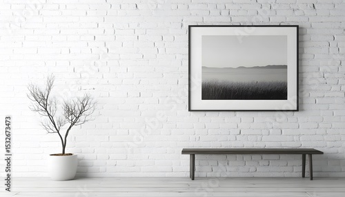 Black and white landscape print on a white brick wall.