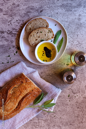 Stone Baked Light Rye Sourdough Bread Served with Olive Oil and Balsamic Vinegar.