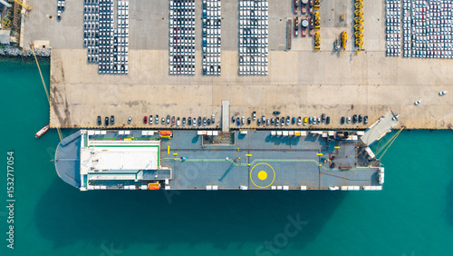 Aerial view Ro-Ro Ship of business logistic sea freight, New Cars produced by year up in the port for Cargo ship and Cargo import-export around in the world. cargo ship by tug boat