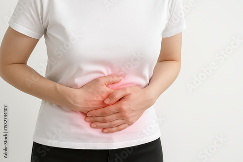 Wallpaper Mural Pain stomach ache discomfort health abdomen woman holding hands on belly with red highlight indicating pain and discomfort Torontodigital.ca