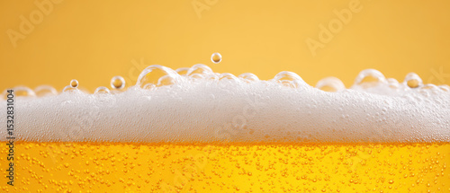 Wallpaper Mural Close up of frothy beer with bubbles against yellow background Torontodigital.ca