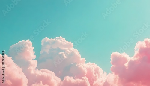 Pastel pink clouds against a teal blue sky.