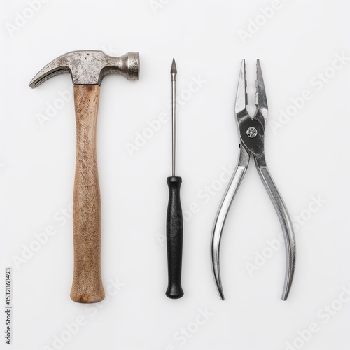 Three essential tools arranged neatly against a backdrop, symbolizing the tools needed for projects and construction.