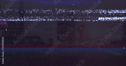 Flickering glitchy analog static filling vintage TV screen, showing red and blue glitch lines