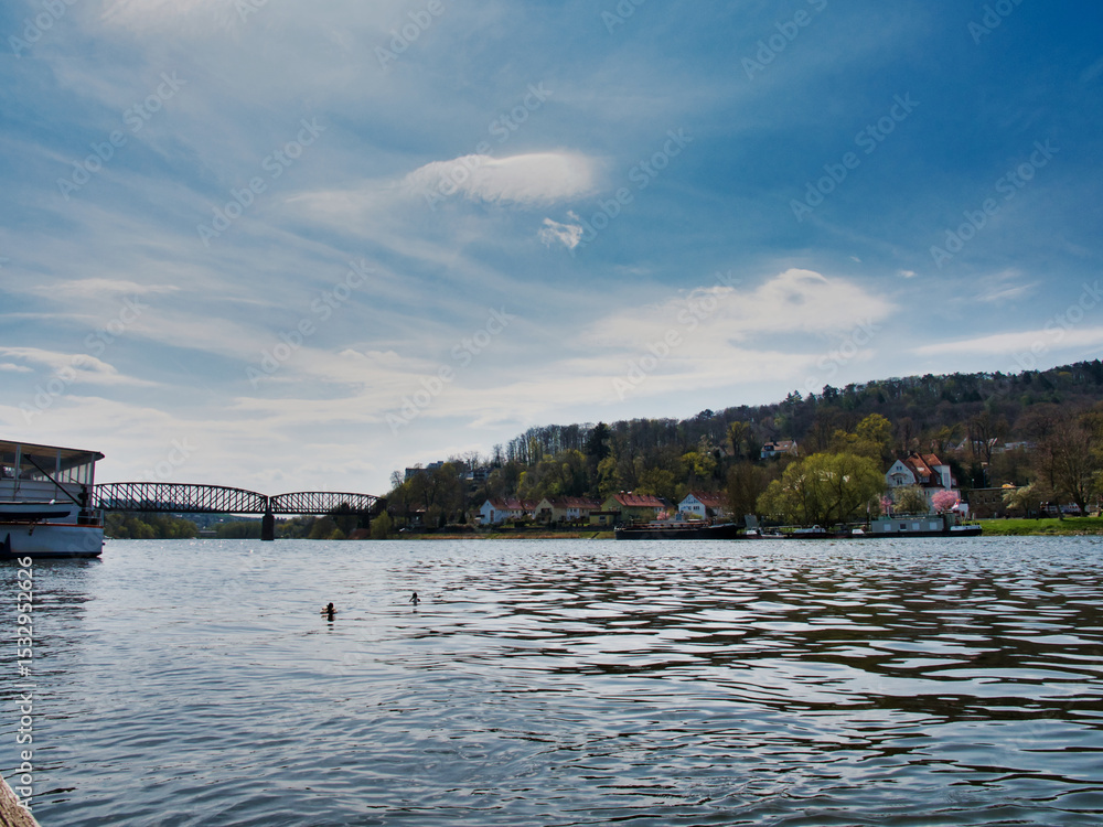 Obraz premium Gorgeous view of the River Weser in Germany with the city of Hameln visible in the back