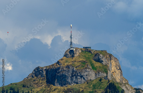 Wallpaper Mural Tower stands tall on a rocky mountainside under a clear blue sky in a remote outdoor location surrounded by nature Torontodigital.ca