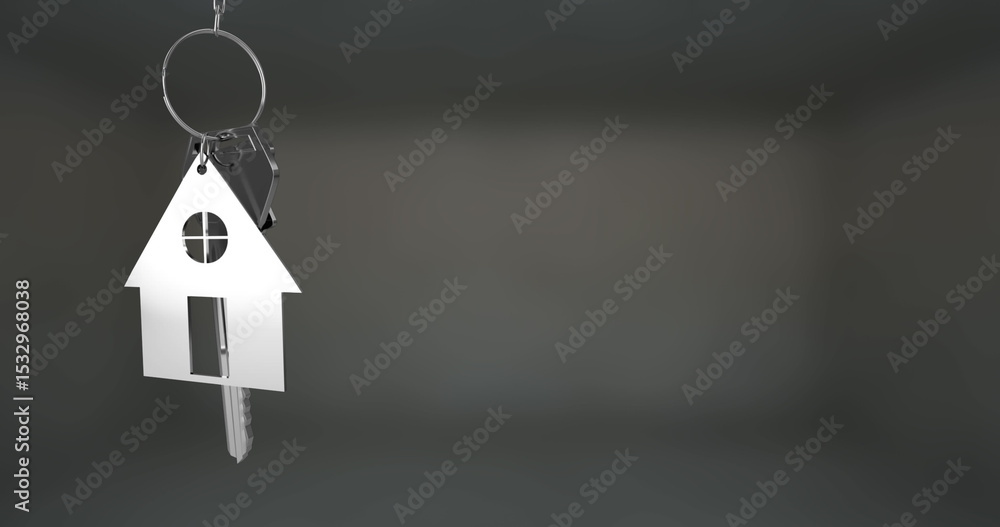 Fototapeta premium Hanging metallic house-shaped keychain and door key reflecting on dark grey backdrop, copy space
