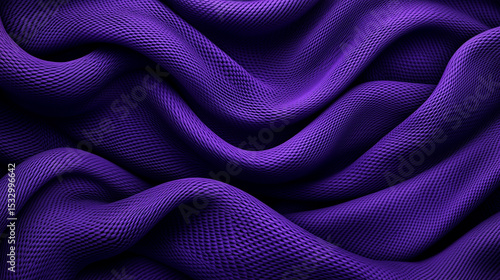 Flowing fabric in rich purple showcases texture and elegance in design elements