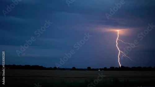 Dramatic lightning storm over open field at dusk captured in high definition