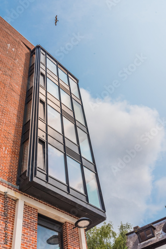 Commercial steel structure featuring concrete, brickwork, and large windows.
