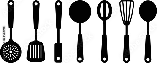 A set of black and white kitchen utensils including spoons and spatulas in a row on white