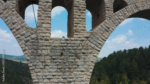 The Varda bridge. The engineering mastery of the massive main arches that carry the railway's load, and the layered auxiliary arches that support them, is revealed in this cinematic shot.
