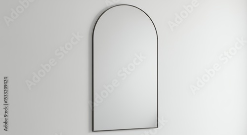 Arch shaped mirror against white wall