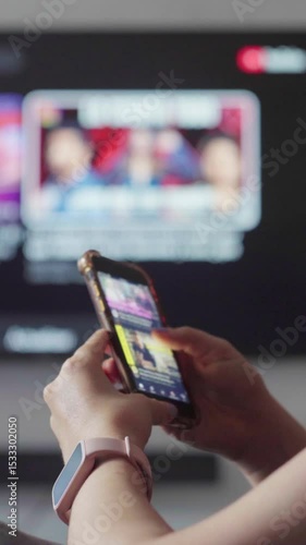 Woman browsing streaming service on smartphone, smart tv screen mirroring digital interface, showcasing modern multimedia connectivity and entertainment technology