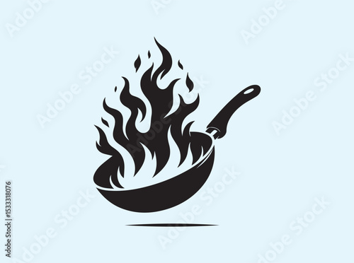 Dramatic black silhouette of a frying pan with fire emerging from within